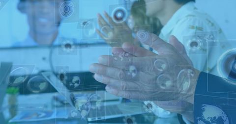 Business Team Applauding with Digital Interface Overlay