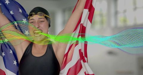 Triumphant Swimmer Holding American Flag in Gym