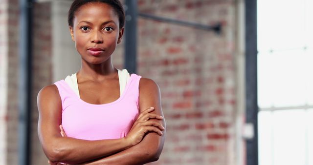 Confident Athletic Woman in Sportswear at Gym - Download Free Stock Images Pikwizard.com