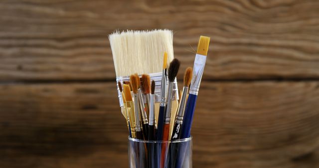 Collection of Various Paint Brushes in Glass Cup on Wooden Background - Download Free Stock Images Pikwizard.com