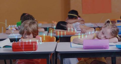 Students resting heads during class in school classroom
