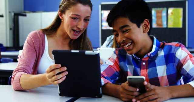Students using digital tablet and mobile phone in classroom at school - Download Free Stock Photos Pikwizard.com