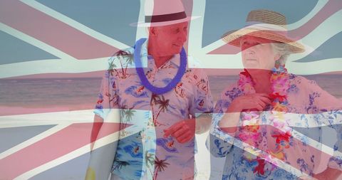 Elderly Couple Enjoying Beach Holiday with Union Jack Overlay