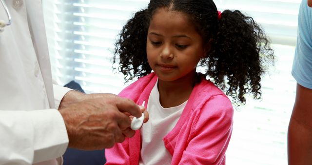 Doctor Caring for Young Patient During Health Checkup - Download Free Stock Images Pikwizard.com