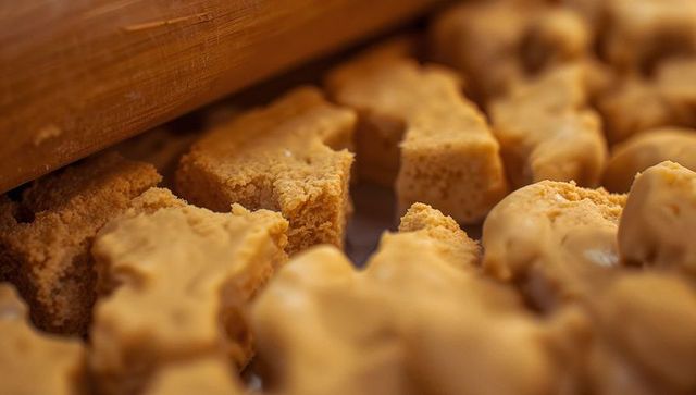 Chunks of Caramel Fudge on Rustic Kitchen Counter