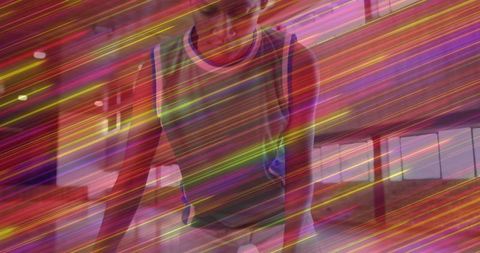 Athletic Woman Holding Plank Exercise in Dynamically Lit Gym