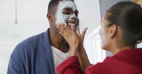 Couple Enjoys Skincare Routine with Face Masks at Home