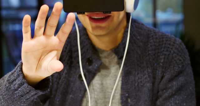 Man Experiencing Virtual Reality Technology with Headset - Download Free Stock Images Pikwizard.com