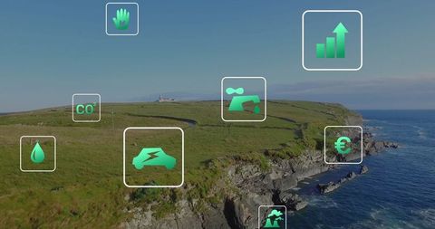 Eco-friendly icons floating over scenic coastal cliff