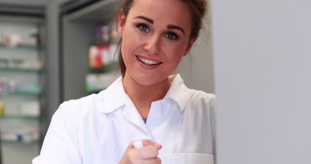 Smiling Pharmacist Offering Assistance in Pharmacy - Download Free Stock Images Pikwizard.com