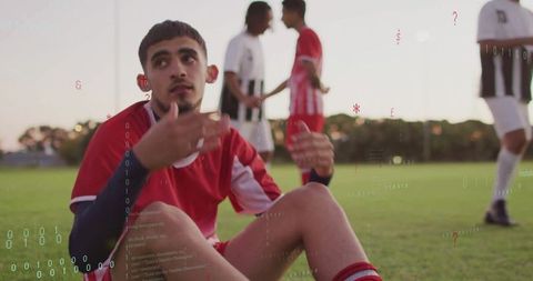 Frustrated Soccer Player Gesturing During Sunset Match on Field