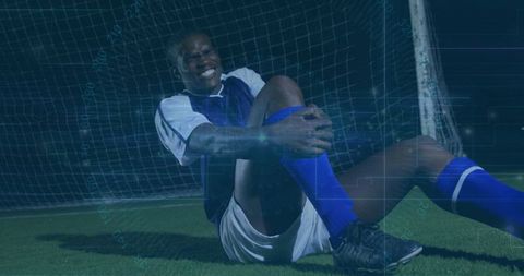 Injured football player on turf imagery of athletic challenge