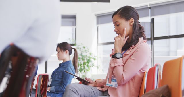 Businesswoman Using Tablet During Meeting in Modern Office - Download Free Stock Images Pikwizard.com