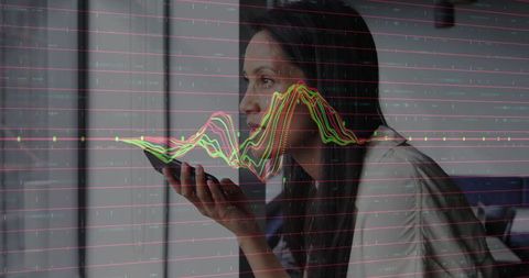 Business woman issuing voice command on smartphone with data overlay