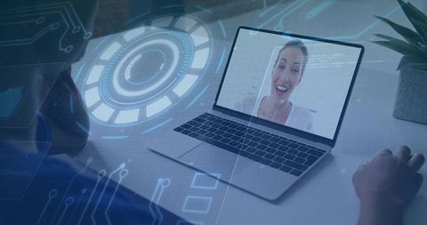 Smiling speaker on laptop during remote meeting with futuristic holographic interface