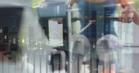 Female professional walking through modern office with financial candlestick data overlay