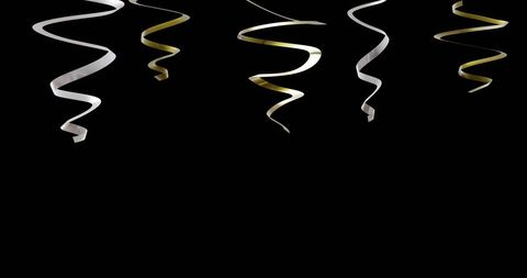 gold and silver streamers on black background for celebrations - Download Free Stock Images Pikwizard.com
