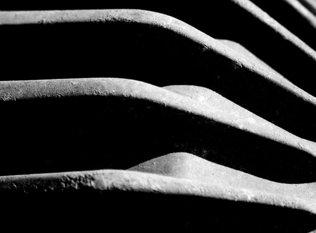 Close-Up of Abstract Metal Ridges in Contrasting Light - Download Free Stock Photos Pikwizard.com