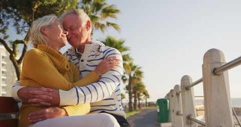 Senior Couple Embracing on Park Bench at Seaside - Download Free Stock Images Pikwizard.com