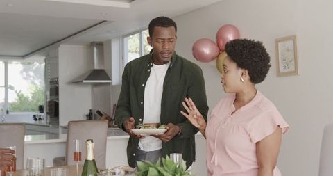 Friends Talking Over Brunch in Contemporary Kitchen Setting