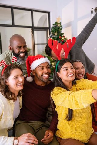 Diverse Friends Celebrating Christmas with Selfie at Home