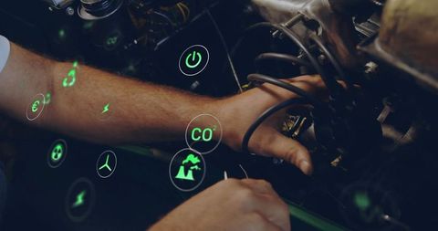 Mechanic Diagnosing Car Engine with Futuristic Virtual Interface