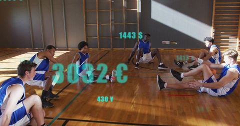 Male basketball team stretching on sunlit gym court with teal digital overlay metrics