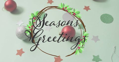 Seasons Greetings with Christmas Ornaments on Pastel Background