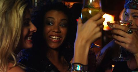 Diverse Group of Women Celebrating Night Out at Vibrant Bar - Download Free Stock Images Pikwizard.com