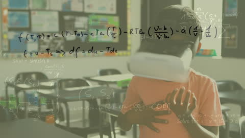 Young Boy Uses VR Headset with Math Equations in Classroom