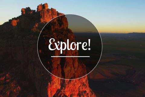 majestic red rock mountain at sunset with explore overlay design - Download Free Stock Templates Pikwizard.com