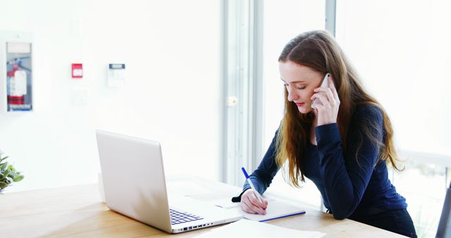 Young Woman Working Remotely on Phone with Laptop - Download Free Stock Images Pikwizard.com