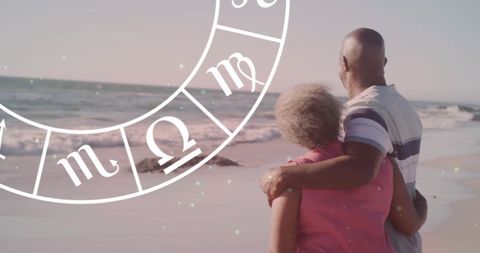 Senior Couple Embracing Beachside with Zodiac Symbol Overlay