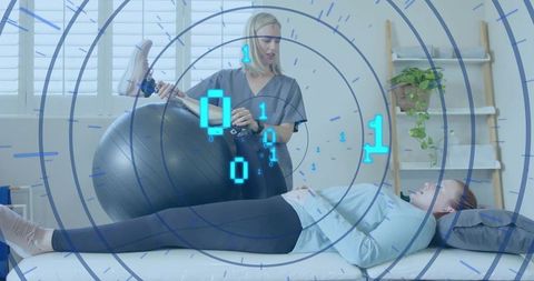 Physical therapist assisting patient with digital overlay technology