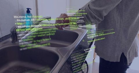 Woman cleaning dishes with overlaid digital code symbolizing technology integration