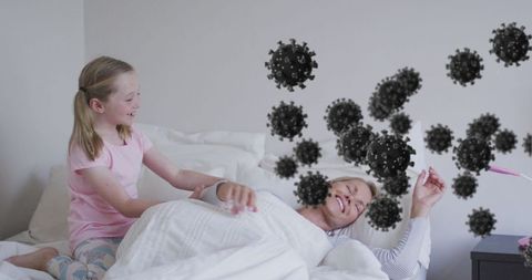 Caring child nursing parent in bed while unwell