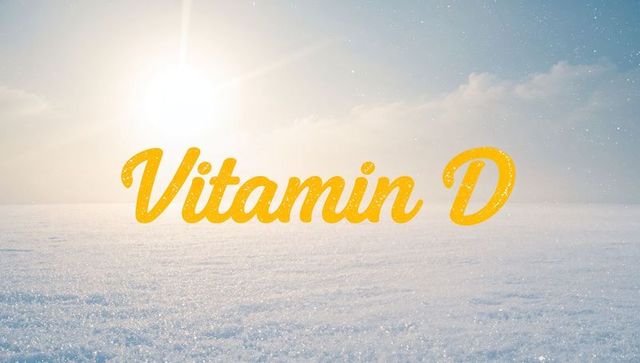 Vitamin d sunshine text over snowy landscape featuring bright sun glare and sparkling snow