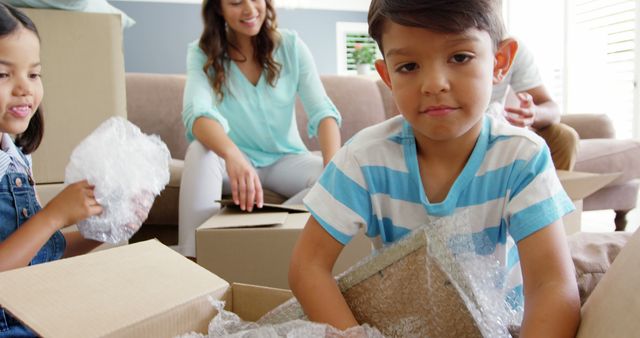 Family Moving into New Home with Boxes and Smiling Children - Download Free Stock Images Pikwizard.com