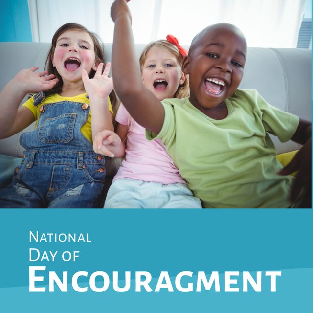 Image features joyful multiracial girls sitting together on a sofa at home, celebrating National Day of Encouragement. Ideal for advertisements and content promoting diversity, unity, and children's well-being. Great for educational materials, community events, and social media campaigns focused on encouragement and positivity.