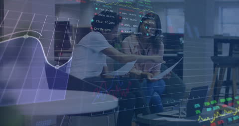 Business People Analyzing Financial Statistics and Graphs in Office