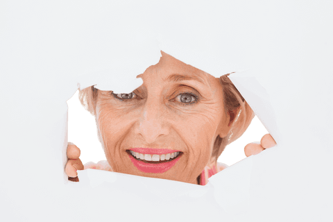 Senior Woman Smiling Through Torn Transparent Surface - Download Free Stock Videos Pikwizard.com