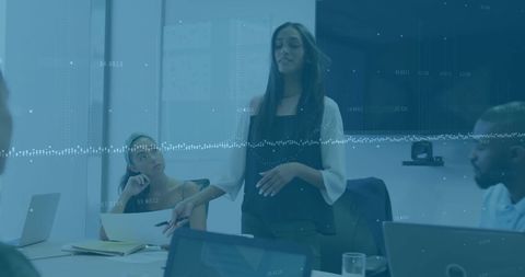 Diverse Team Discussing Strategy in Corporate Meeting Room