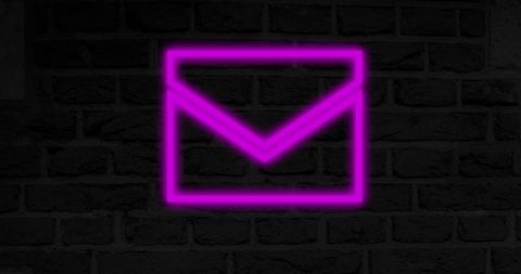 Bright Neon Envelope Icon on Dark Brick Wall