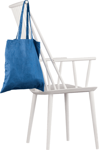 Blue tote bag draped on white wooden chair with transparent background