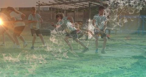 Dynamic tug-of-war among children in vibrant playground