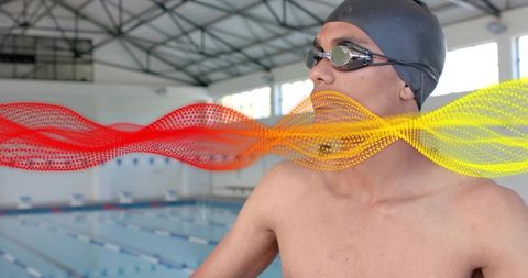 Competitive Swimmer Preparing at Indoor Pool with Vibrant Wave Overlay