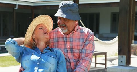 Senior couple enjoying sunny outdoor relaxation