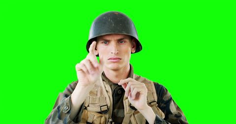 Soldier interacting with virtual screen in tactical gear