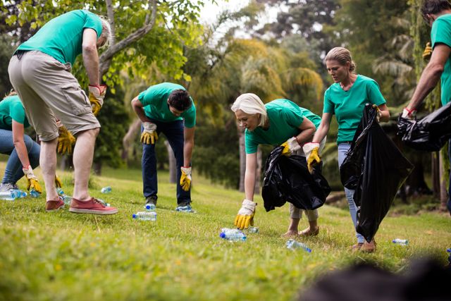 Team of Volunteers Picking Up Litter in Park - Download Free Stock Photos Pikwizard.com