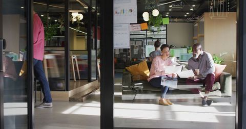 Team Collaboration in Contemporary Office on Couch